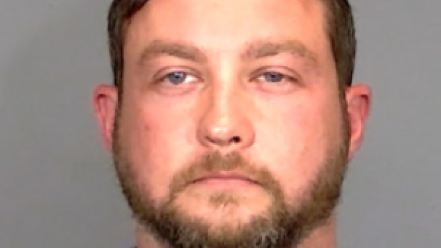 INDIANAPOLIS POLICE OFFICER ARRESTED FOR HARASSING EX-WIFE WHILE ON DUTY
